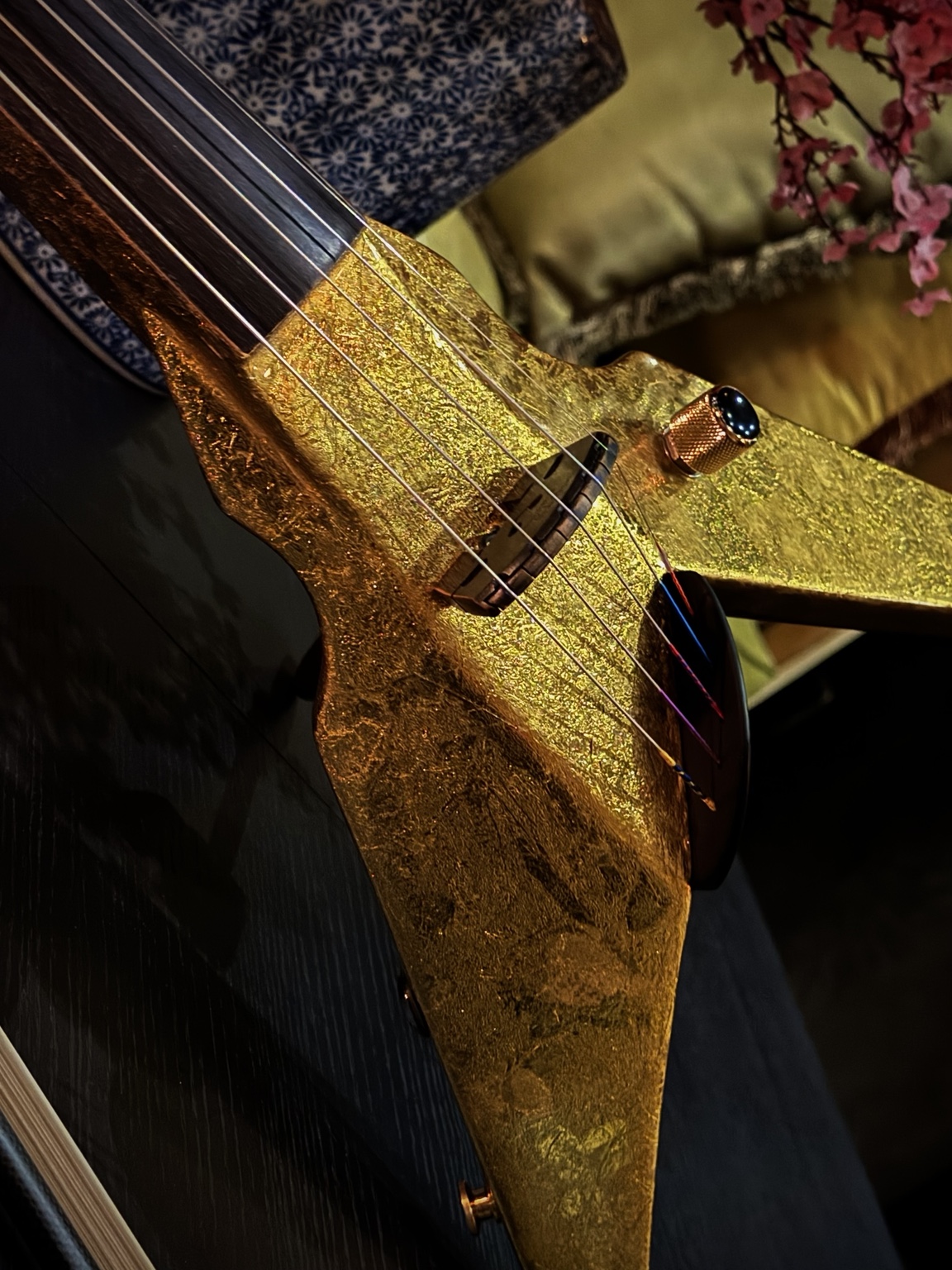 Close detail of Nico's gold electric violin